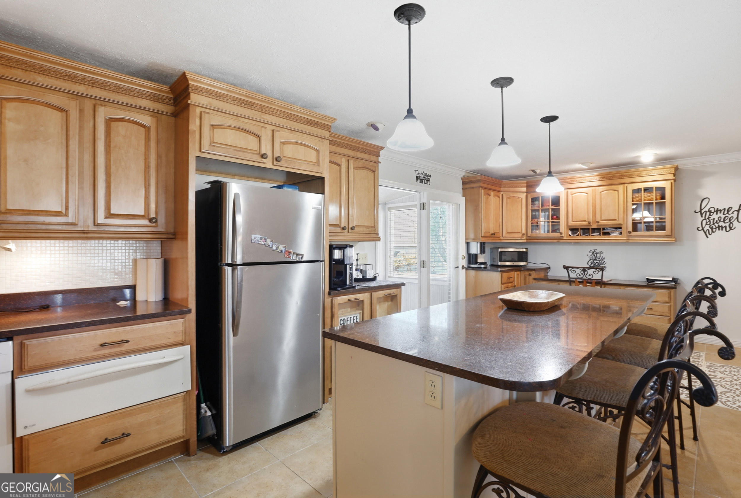 333 Rainbow Ridge Swainsboro, GA 30401 - Photo 15 of 46 a kitchen with stainless steel appliances granite countertop a refrigerator a sink and a stove