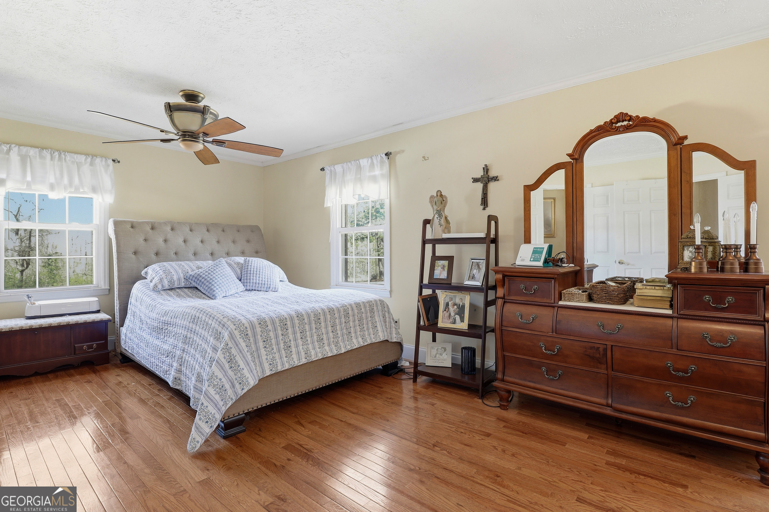 333 Rainbow Ridge Swainsboro, GA 30401 - Photo 16 of 46 a living room with a bed and a chandelier
