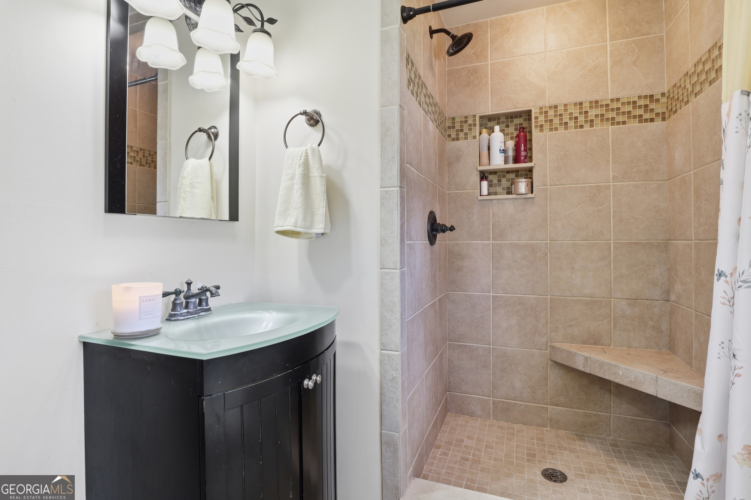 333 Rainbow Ridge Swainsboro, GA 30401 - Photo 20 of 46 a bathroom with a sink a mirror a glass door shower and vanity