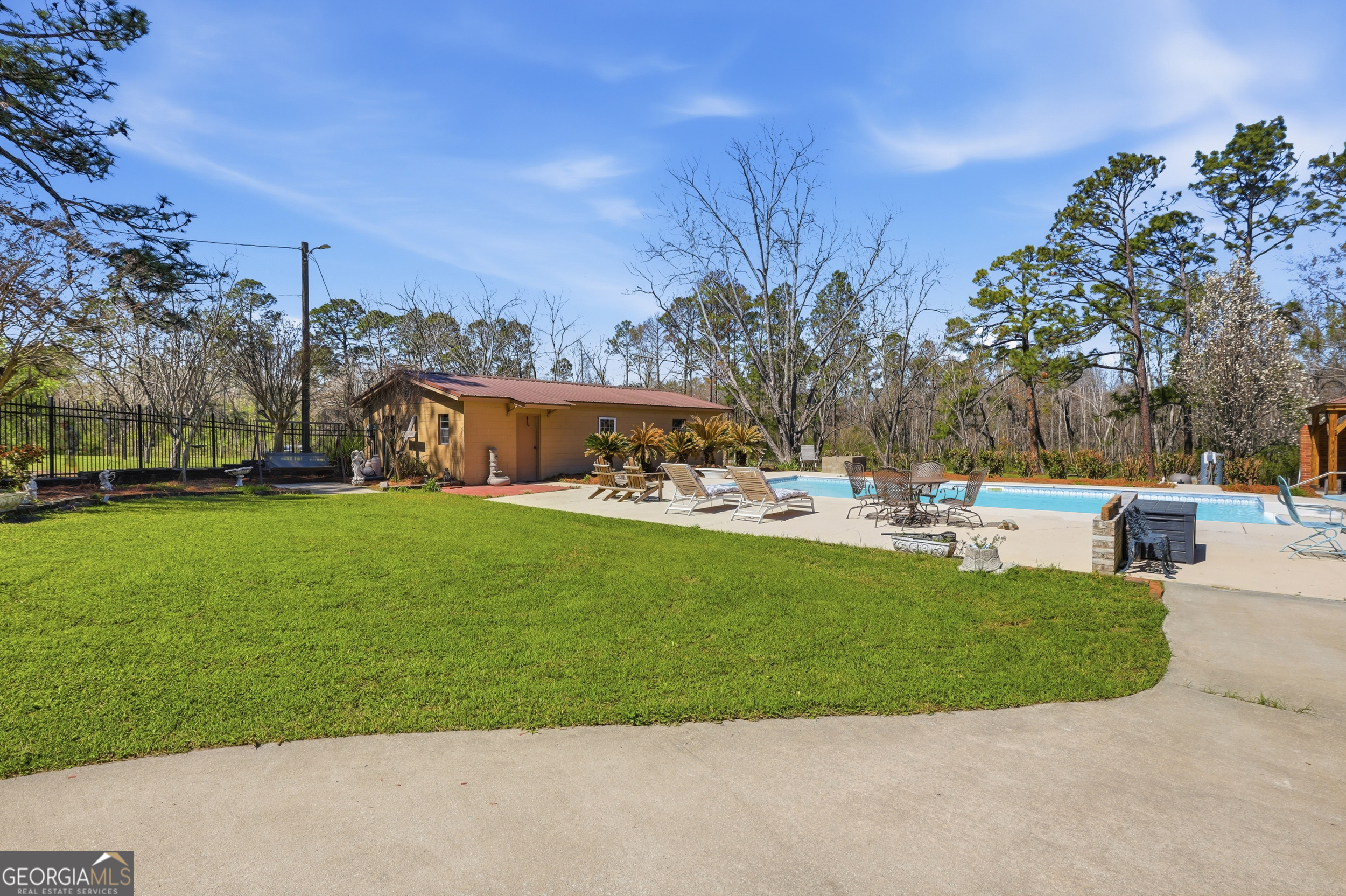 333 Rainbow Ridge Swainsboro, GA 30401 - Photo 27 of 46 a view of yard with swimming pool and green space