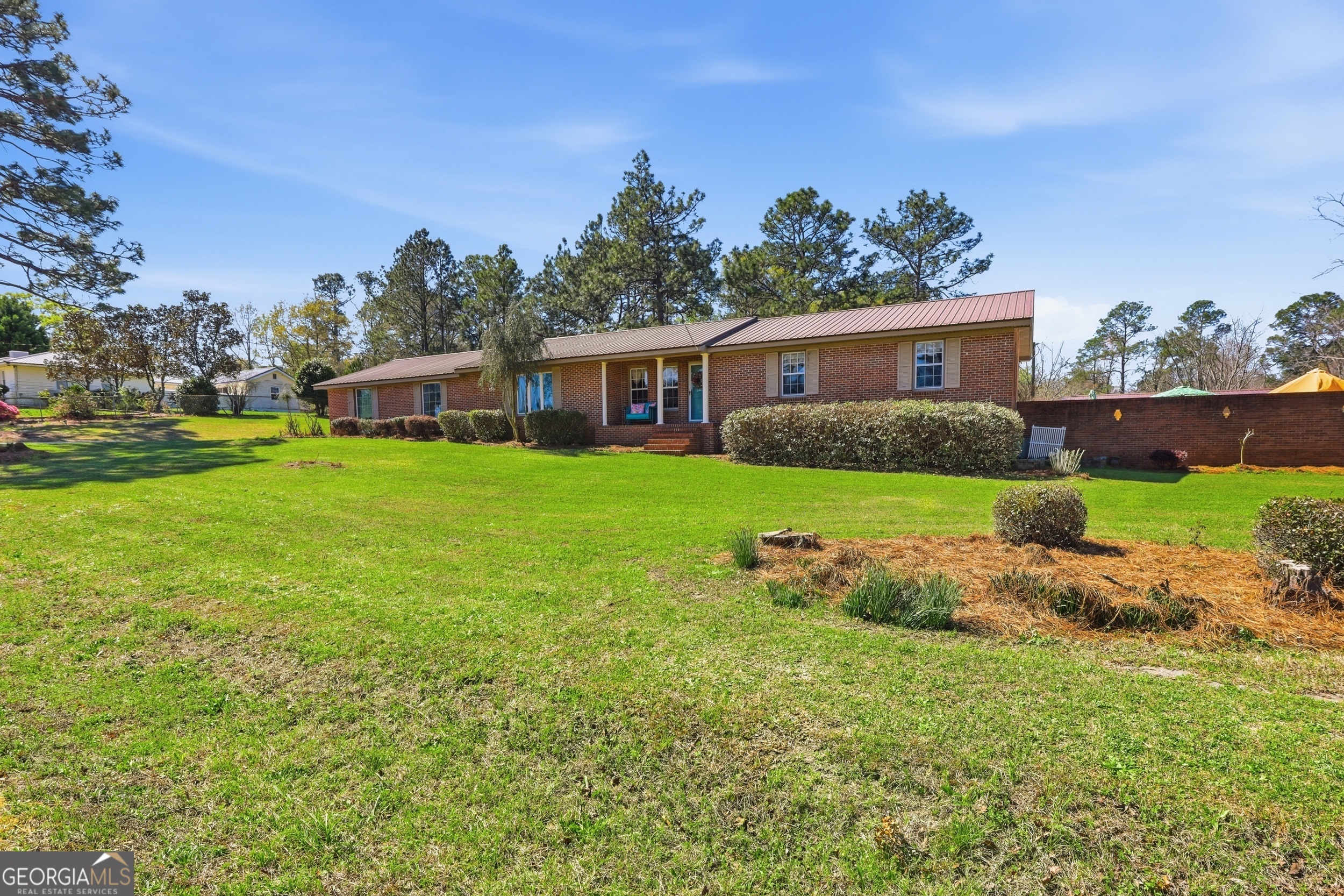 333 Rainbow Ridge Swainsboro, GA 30401 - Photo 3 of 46 a front view of house with yard and trees