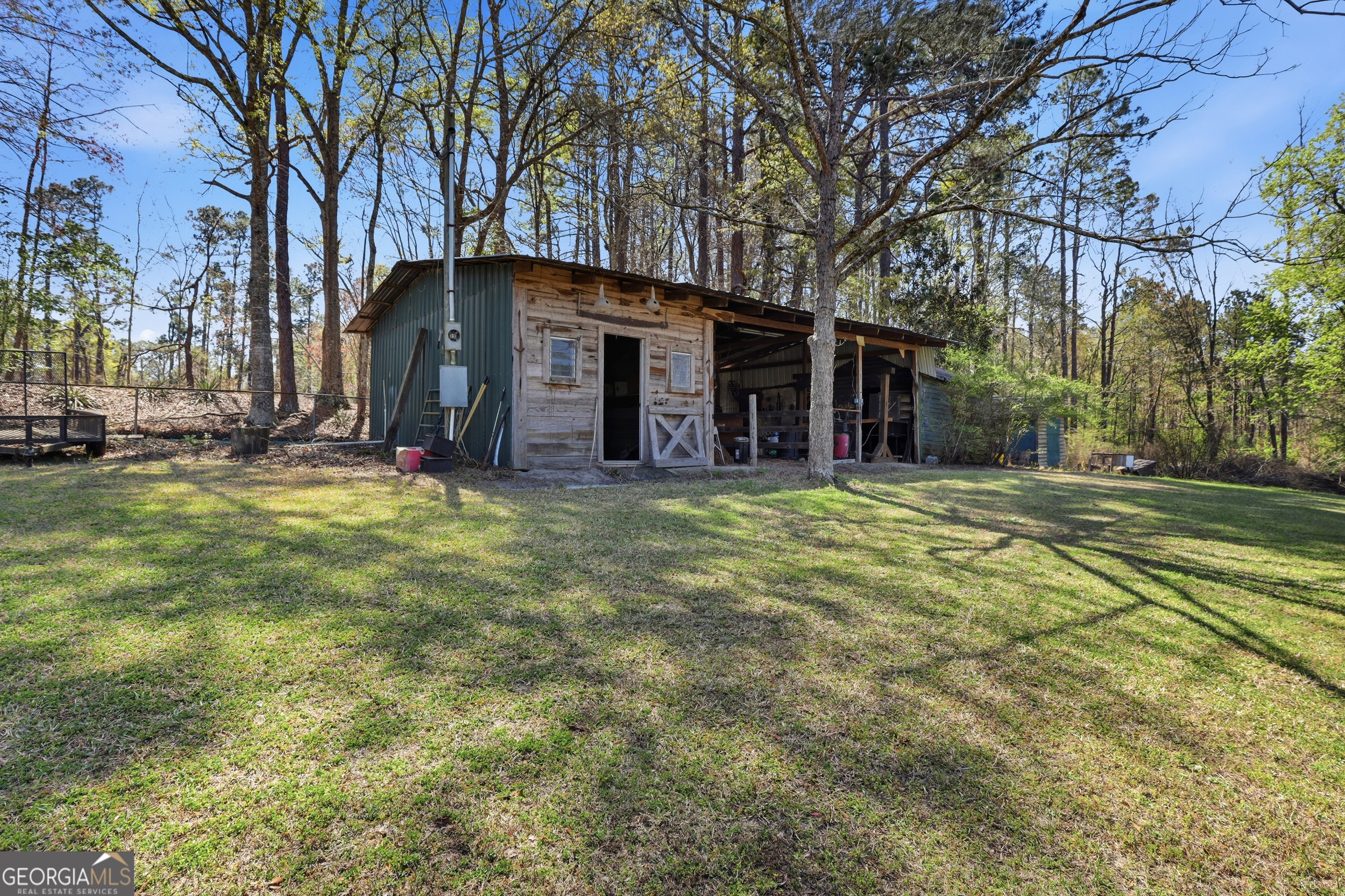 333 Rainbow Ridge Swainsboro, GA 30401 - Photo 33 of 46 a view of a house with a yard and large trees