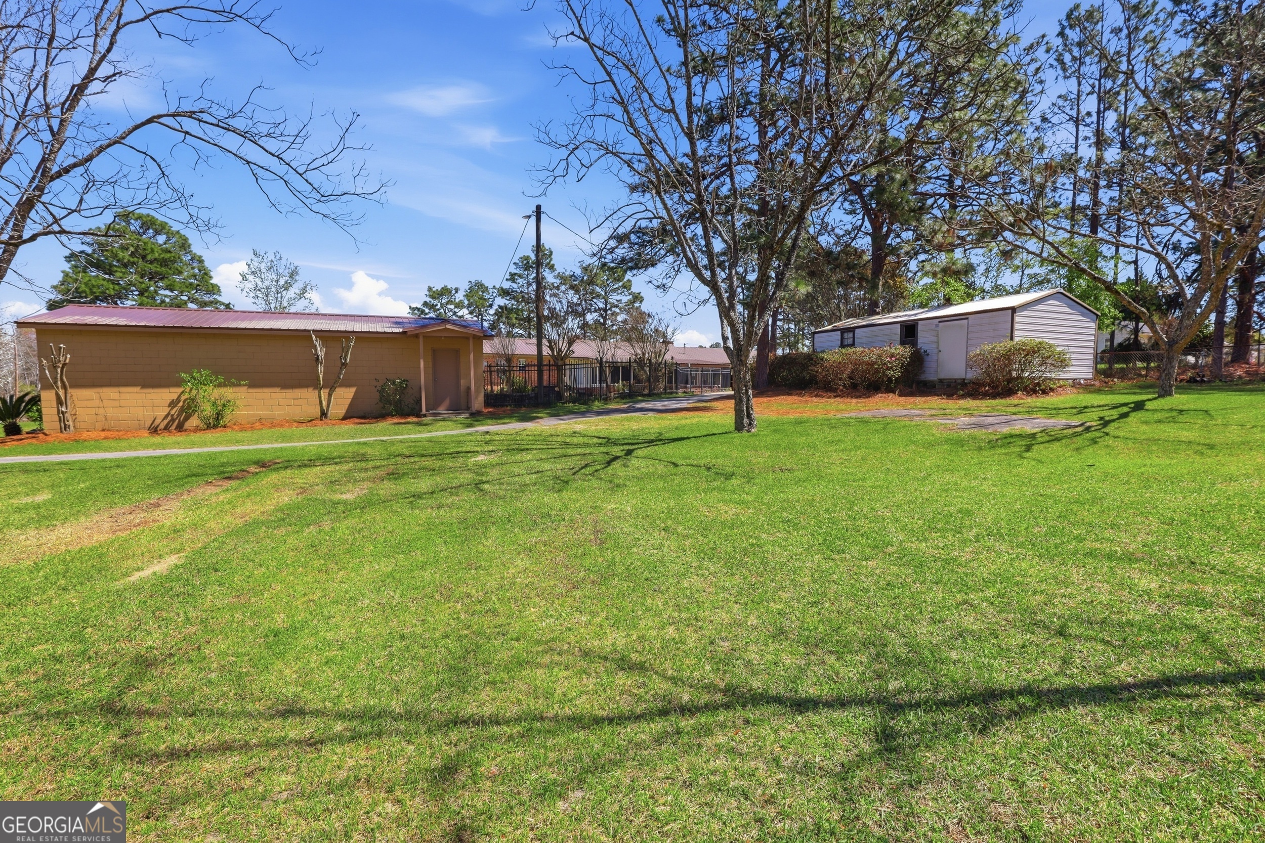 333 Rainbow Ridge Swainsboro, GA 30401 - Photo 34 of 46 a view of a backyard with large trees