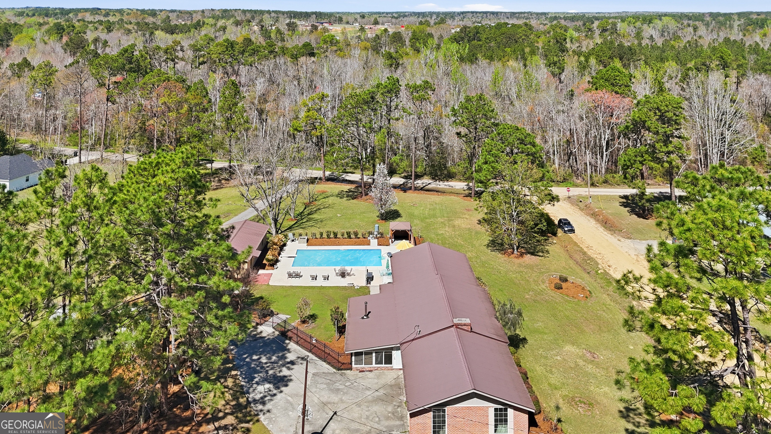 333 Rainbow Ridge Swainsboro, GA 30401 - Photo 43 of 46 a view of a house with a yard and sitting area