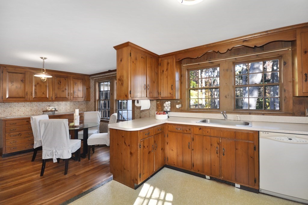 46 Concord Road Acton, MA 01720 - Photo 11 of 33 a open kitchen with kitchen island a sink table and chairs