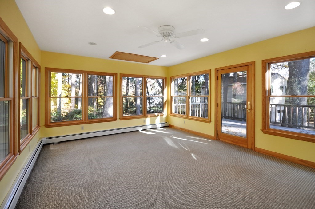 46 Concord Road Acton, MA 01720 - Photo 13 of 33 a view of an empty room with a fireplace and a large window