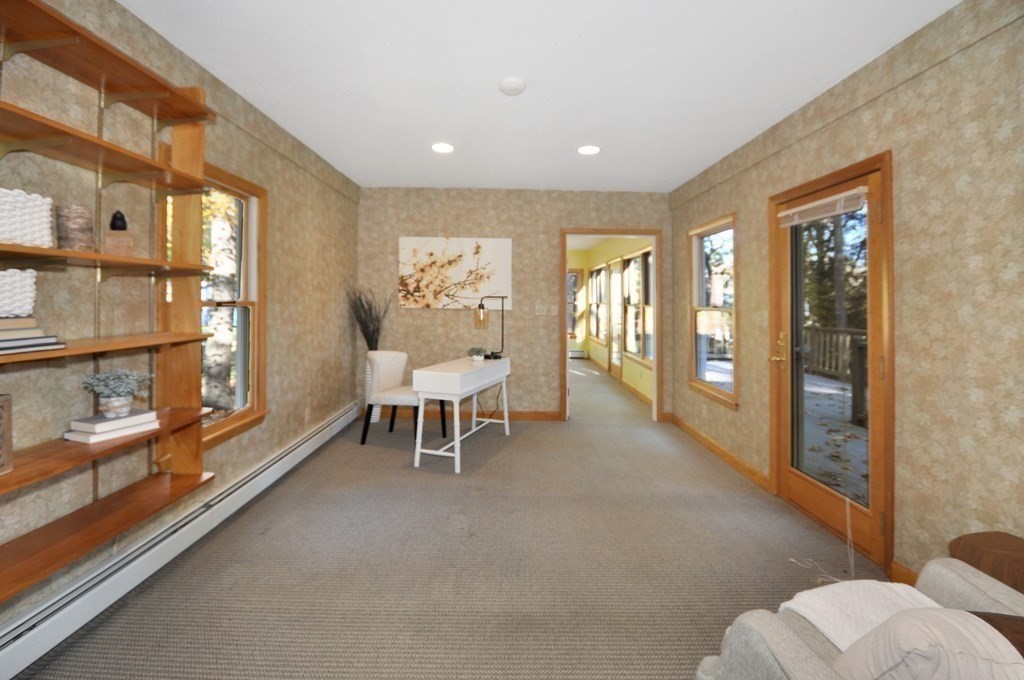 46 Concord Road Acton, MA 01720 - Photo 15 of 33 a living room with furniture and a large window