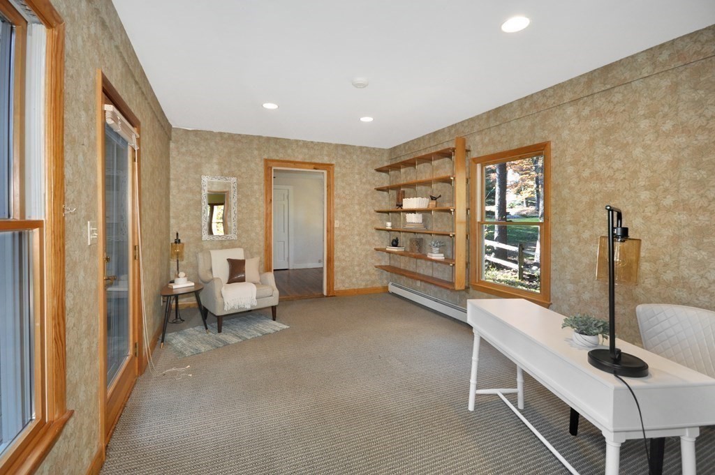 46 Concord Road Acton, MA 01720 - Photo 16 of 33 a hallway with a furniture and floor to ceiling window