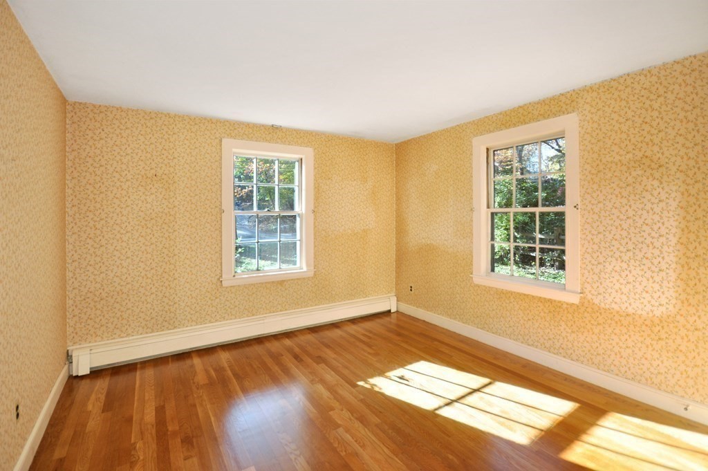 46 Concord Road Acton, MA 01720 - Photo 18 of 33 a view of an empty room with wooden floor and a window