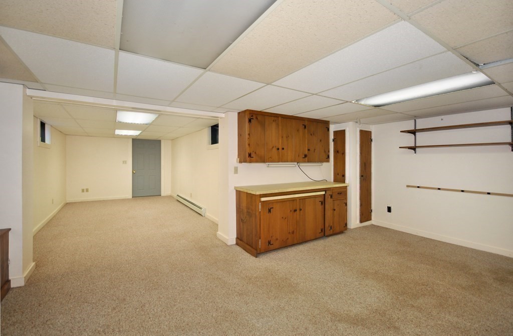 46 Concord Road Acton, MA 01720 - Photo 23 of 33 a view of a kitchen with a sink and a refrigerator