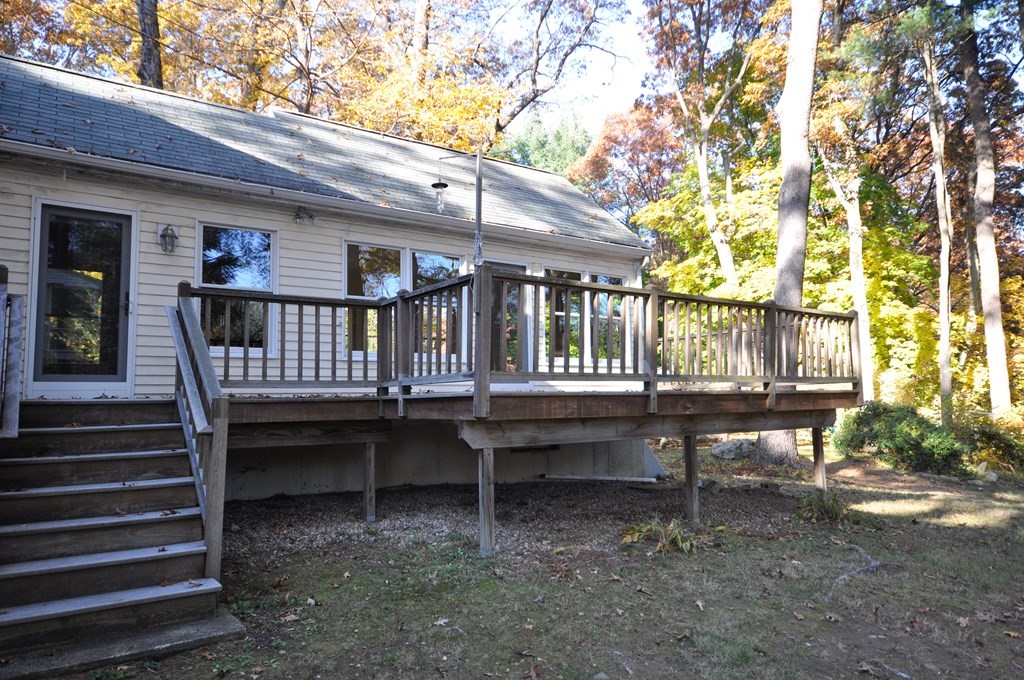 46 Concord Road Acton, MA 01720 - Photo 30 of 33 a view of a patio with a table and chairs