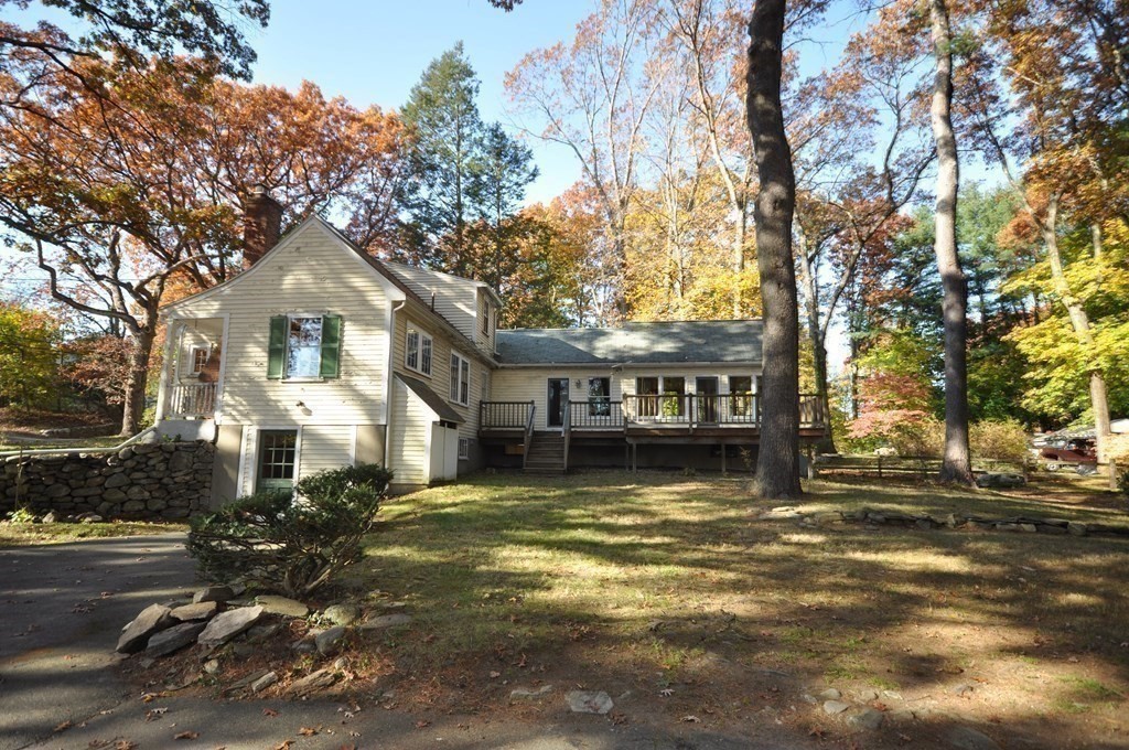 46 Concord Road Acton, MA 01720 - Photo 3 of 33 a view of a house with a large tree in front of it