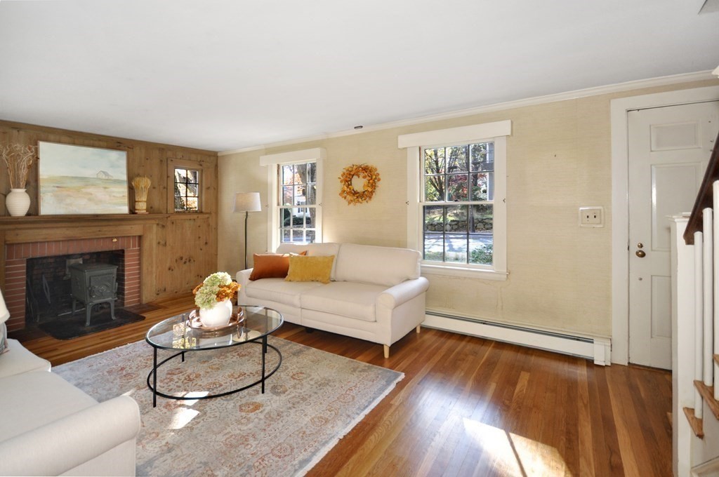 46 Concord Road Acton, MA 01720 - Photo 5 of 33 a living room with furniture and a fireplace