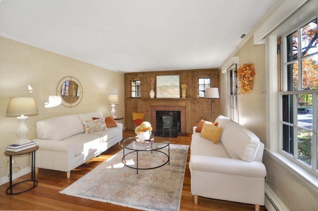 46 Concord Road Acton, MA 01720 - Photo 6 of 33 a living room with furniture a fireplace and a large window