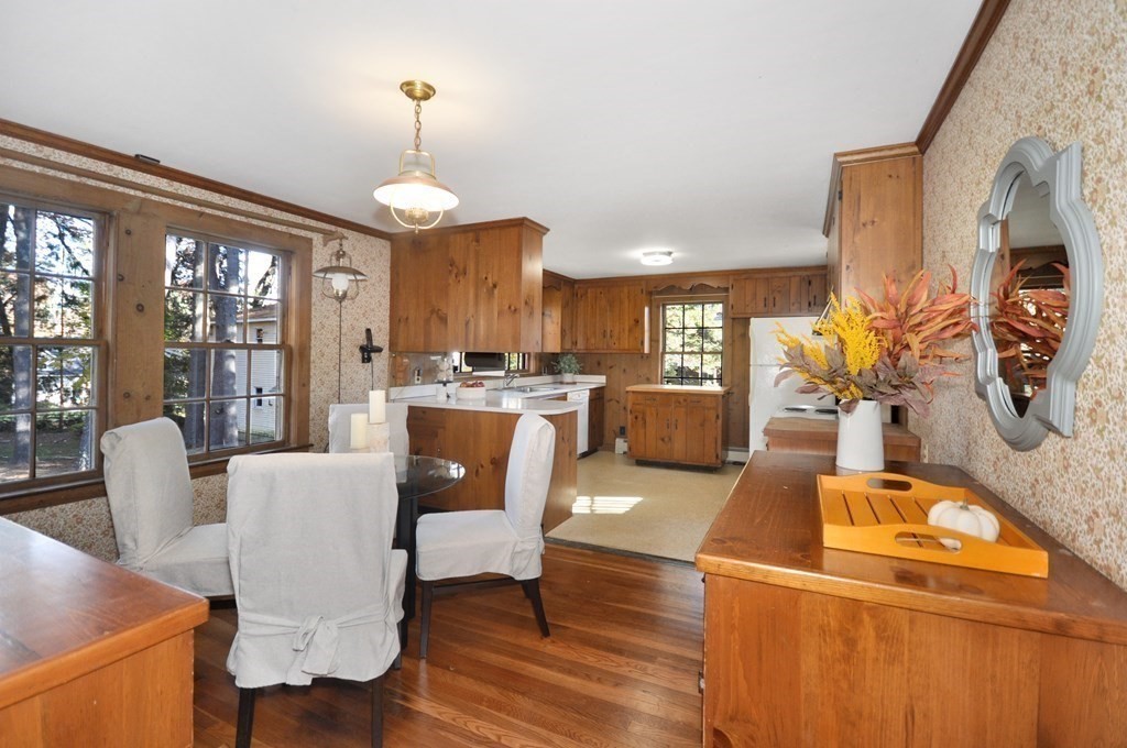 46 Concord Road Acton, MA 01720 - Photo 8 of 33 a dining room with furniture a chandelier and wooden floor