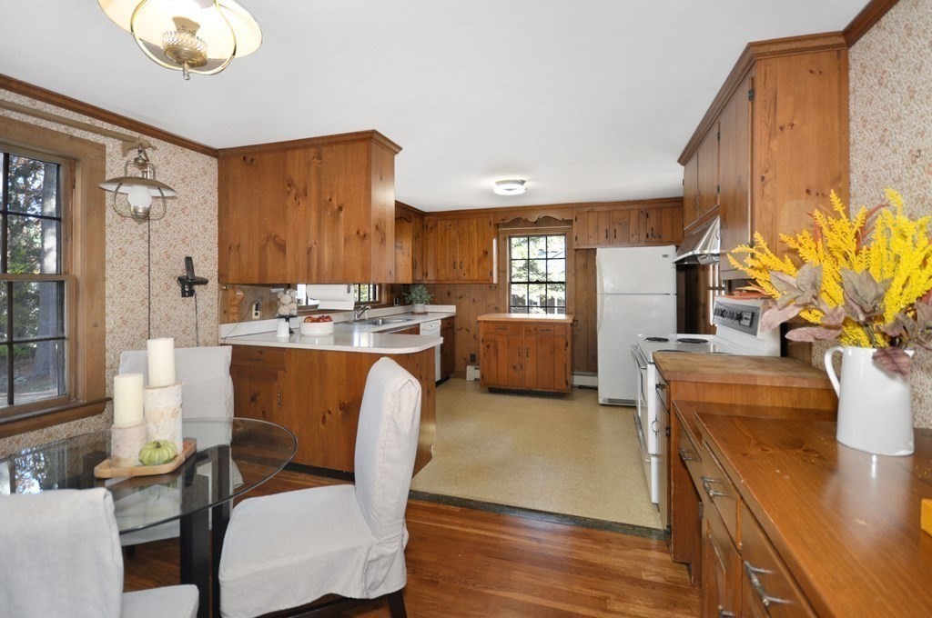 46 Concord Road Acton, MA 01720 - Photo 9 of 33 a living room with furniture kitchen view and a large window
