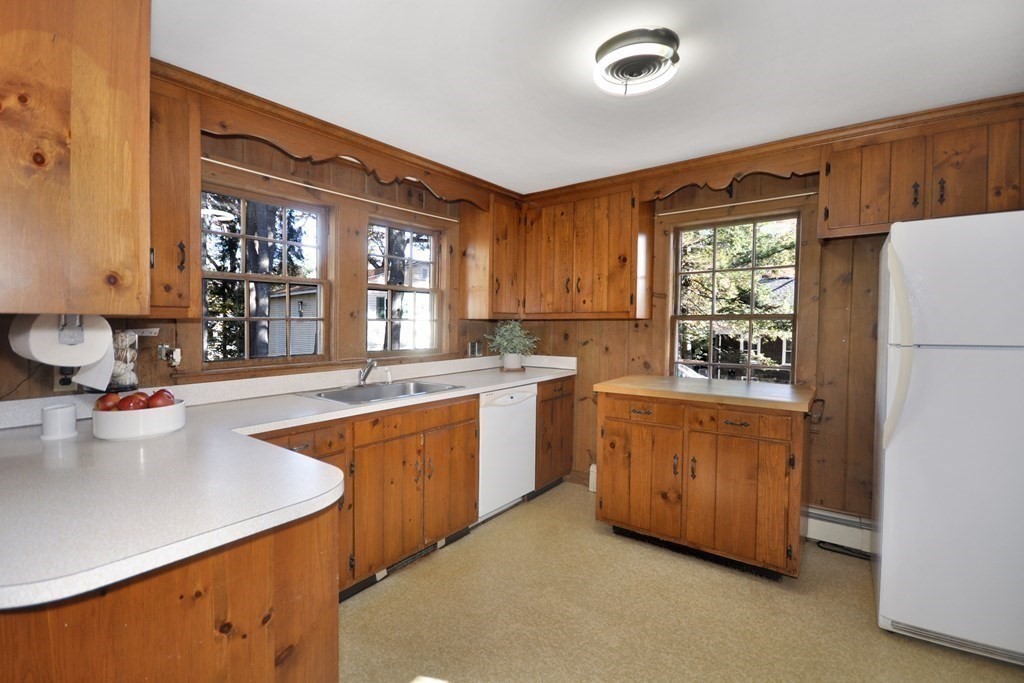 46 Concord Road Acton, MA 01720 - Photo 10 of 33 a kitchen with stainless steel appliances granite countertop a sink stove and refrigerator