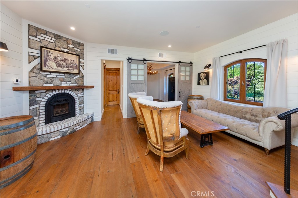 85 Saddlebow Road Bell Canyon, CA 91307 - Photo 19 of 75 a living room with furniture and a fireplace