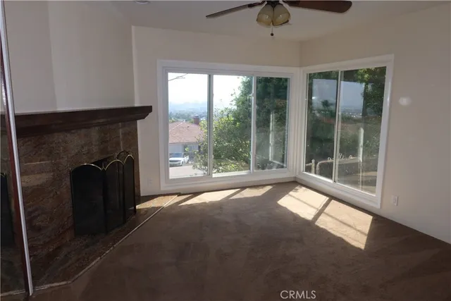 a view of a glass door and a window