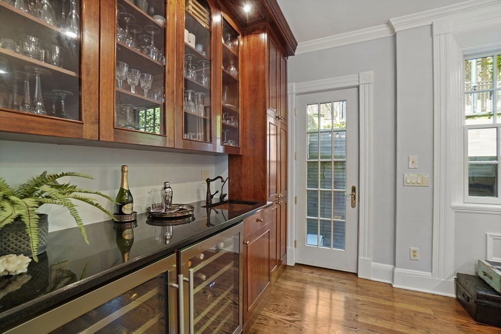 6 Strong Place Boston, MA 02114 - Photo 12 of 38 a kitchen with stainless steel appliances a sink a stove and cabinets