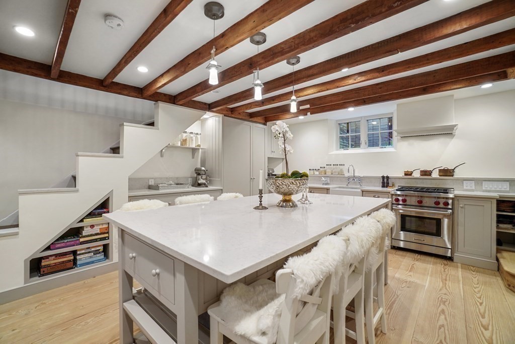 6 Strong Place Boston, MA 02114 - Photo 16 of 38 a kitchen with a stove and a refrigerator