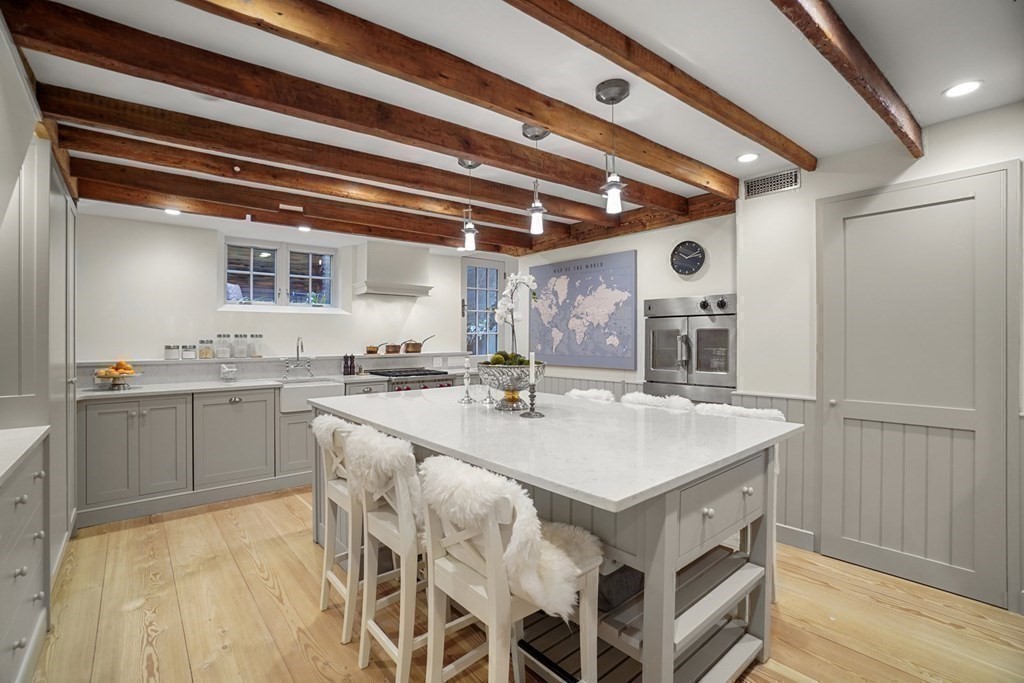 6 Strong Place Boston, MA 02114 - Photo 17 of 38 a kitchen with a sink appliances and cabinets