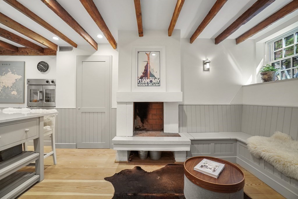 6 Strong Place Boston, MA 02114 - Photo 19 of 38 a living room with furniture and a fireplace