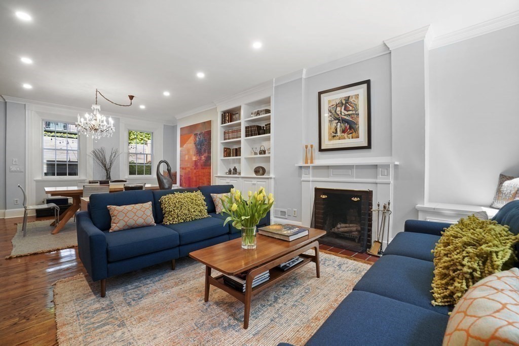 6 Strong Place Boston, MA 02114 - Photo 2 of 38 a living room with furniture and a fireplace