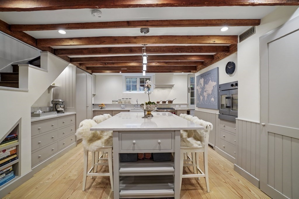 6 Strong Place Boston, MA 02114 - Photo 22 of 38 a view of a kitchen with a sink and cabinets