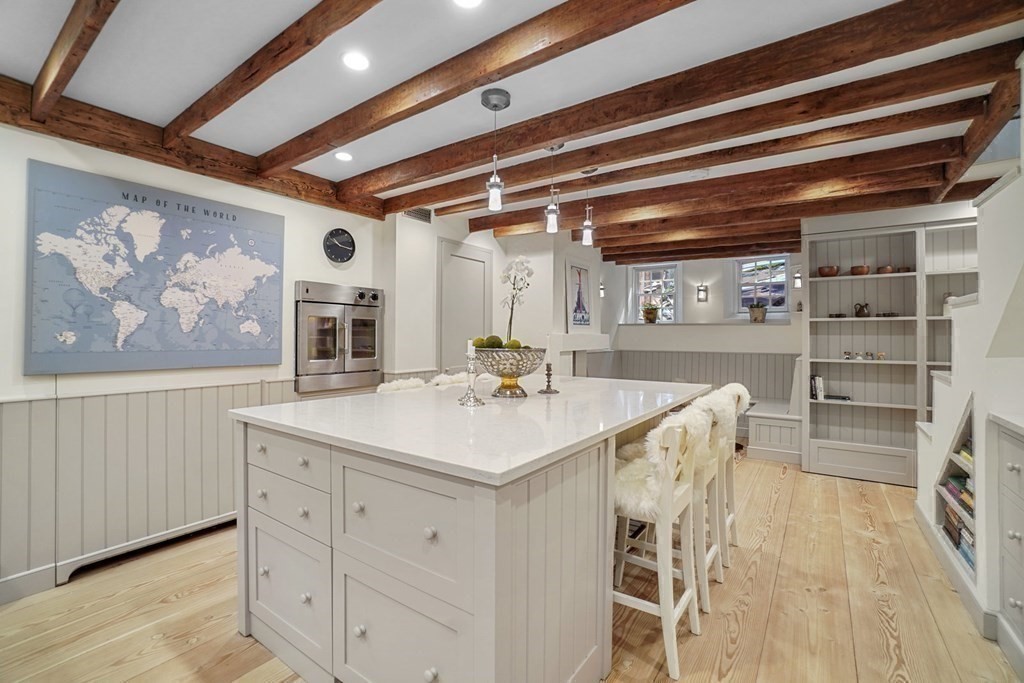 6 Strong Place Boston, MA 02114 - Photo 23 of 38 a kitchen that has a lot of cabinets in it