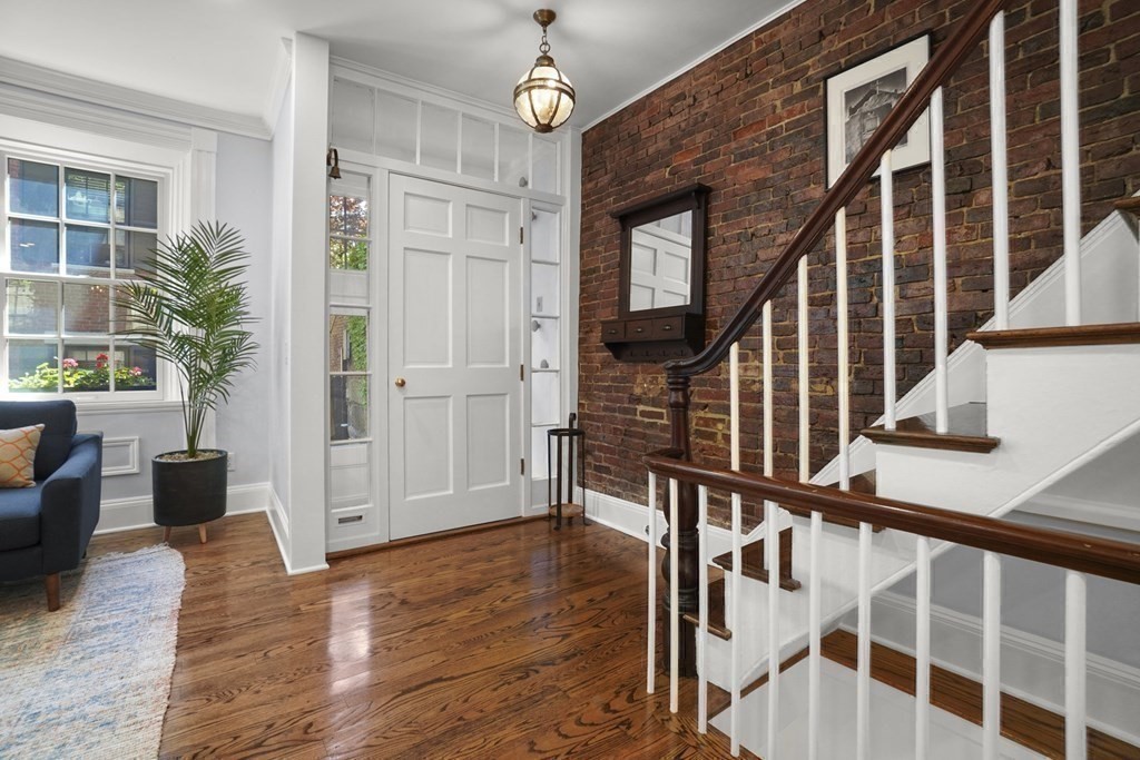 6 Strong Place Boston, MA 02114 - Photo 24 of 38 a view of entryway with wooden floor and stairs