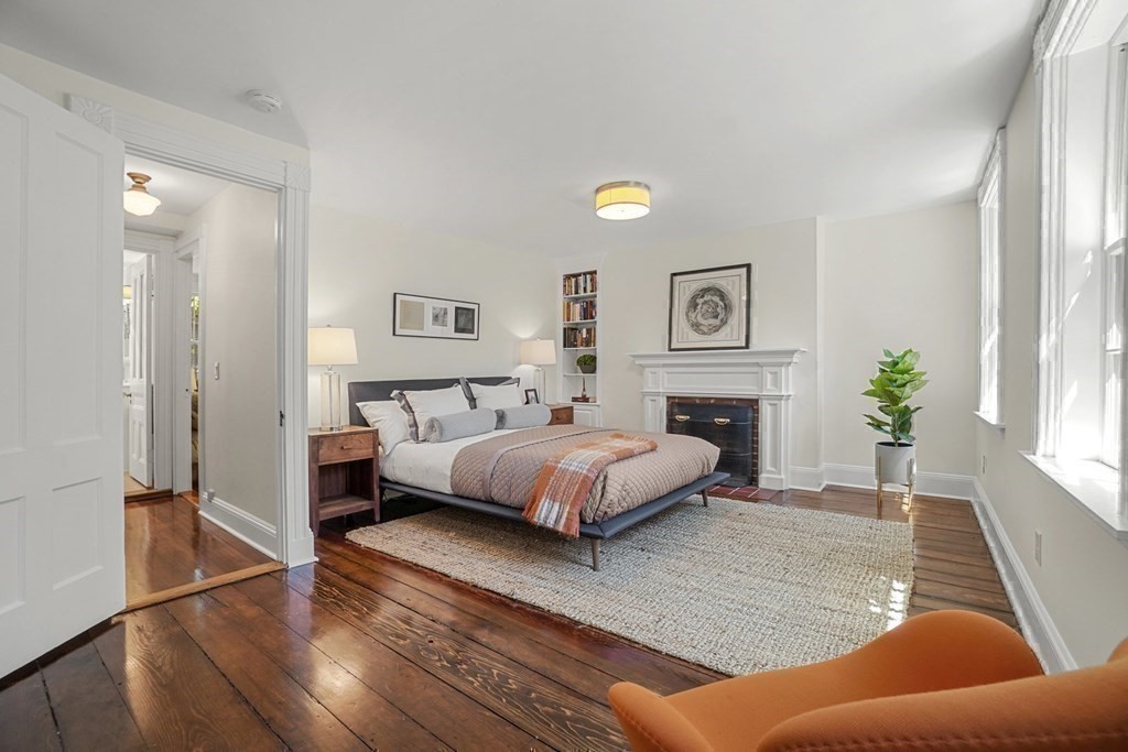 6 Strong Place Boston, MA 02114 - Photo 25 of 38 a spacious bedroom with a bed and window