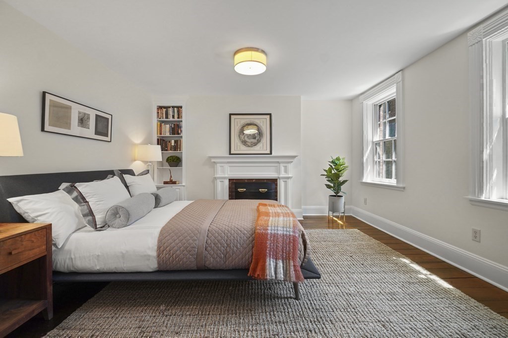 6 Strong Place Boston, MA 02114 - Photo 26 of 38 a spacious bedroom with a bed and a couch