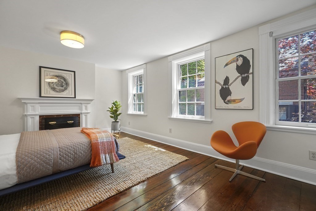 6 Strong Place Boston, MA 02114 - Photo 27 of 38 a bedroom with a bed and painting on the wall