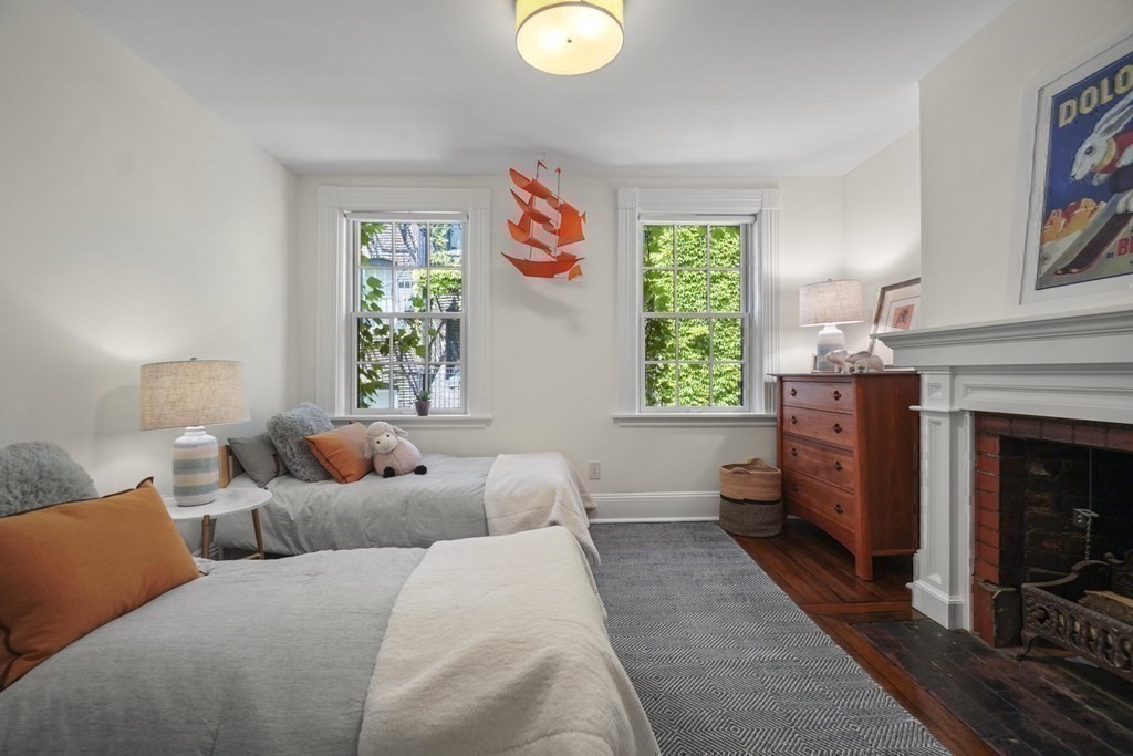 6 Strong Place Boston, MA 02114 - Photo 28 of 38 a living room with furniture and a fireplace