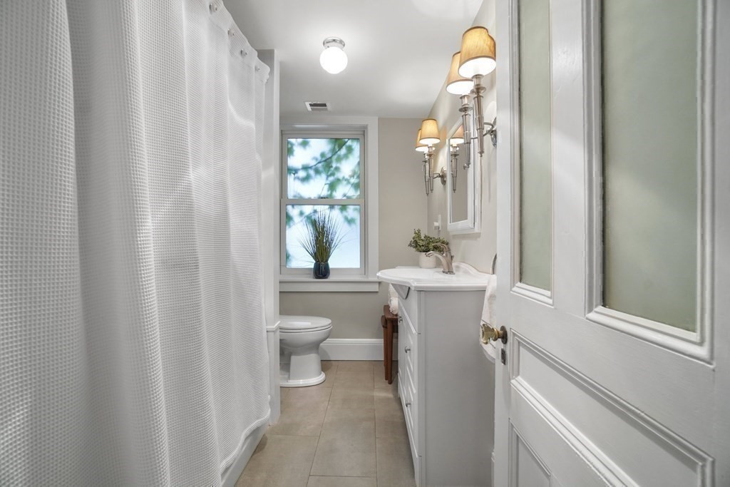 6 Strong Place Boston, MA 02114 - Photo 30 of 38 a bathroom with a sink toilet and shower