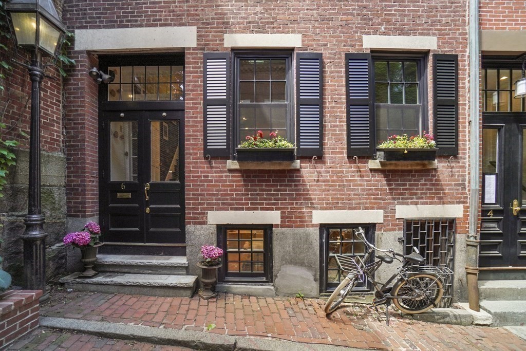 6 Strong Place Boston, MA 02114 - Photo 3 of 38 a view of a brick building with many windows