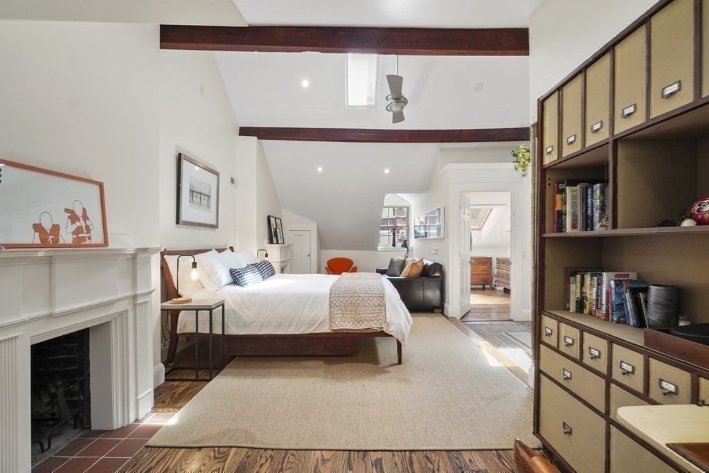 6 Strong Place Boston, MA 02114 - Photo 33 of 38 a bedroom with furniture and a book shelf