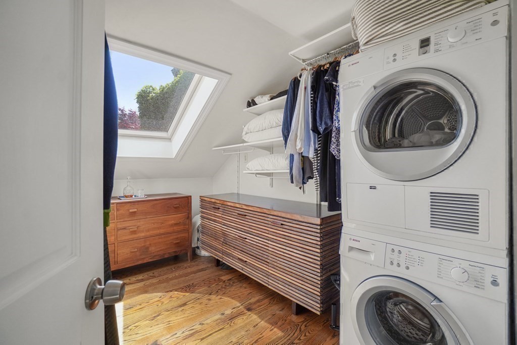 6 Strong Place Boston, MA 02114 - Photo 34 of 38 a view of a hallway with washer and dryer