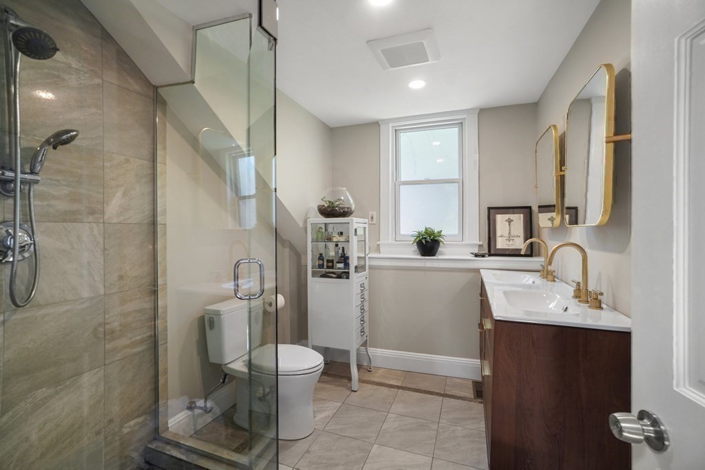 6 Strong Place Boston, MA 02114 - Photo 35 of 38 a bathroom with a sink toilet and shower