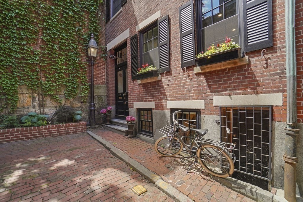 6 Strong Place Boston, MA 02114 - Photo 36 of 38 a view of a brick building with many windows