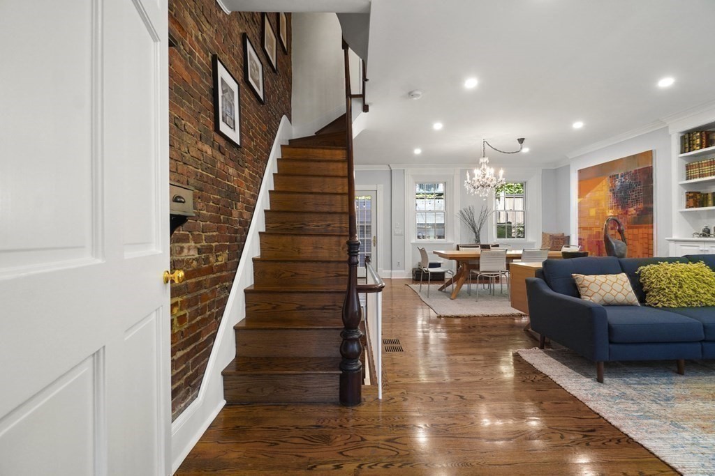 6 Strong Place Boston, MA 02114 - Photo 5 of 38 a living room with furniture and a book shelf