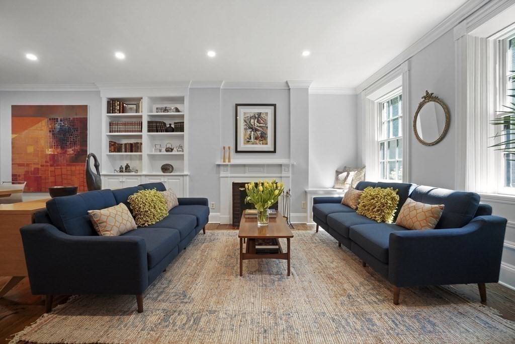 6 Strong Place Boston, MA 02114 - Photo 6 of 38 a living room with furniture and a large window