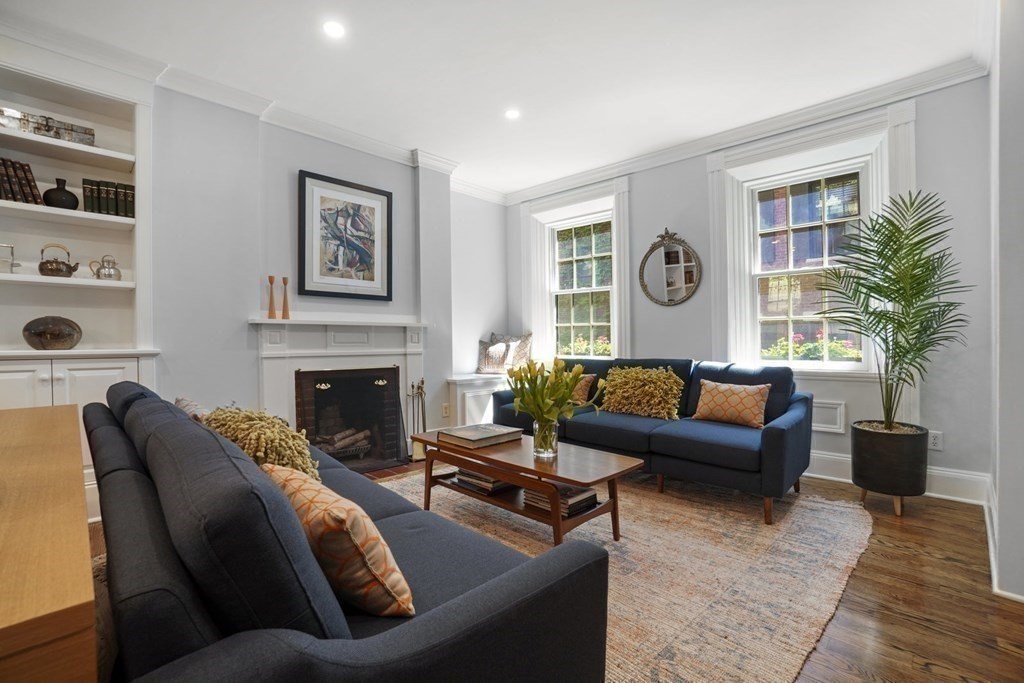 6 Strong Place Boston, MA 02114 - Photo 7 of 38 a living room with furniture and a fireplace
