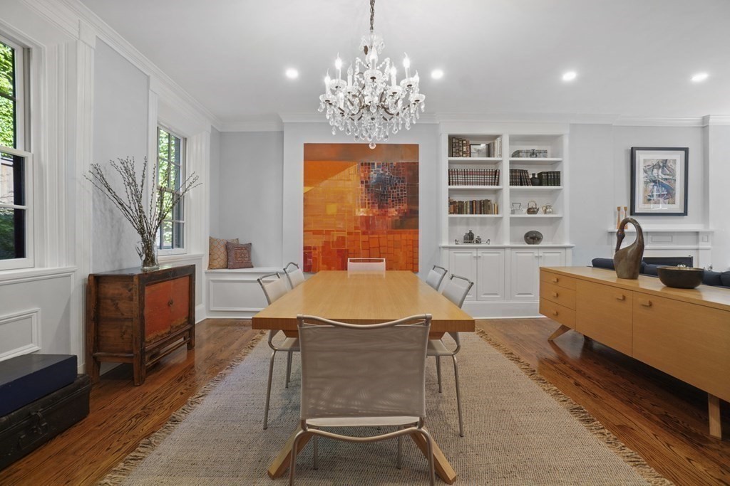 6 Strong Place Boston, MA 02114 - Photo 9 of 38 a living room with patio furniture and a chandelier