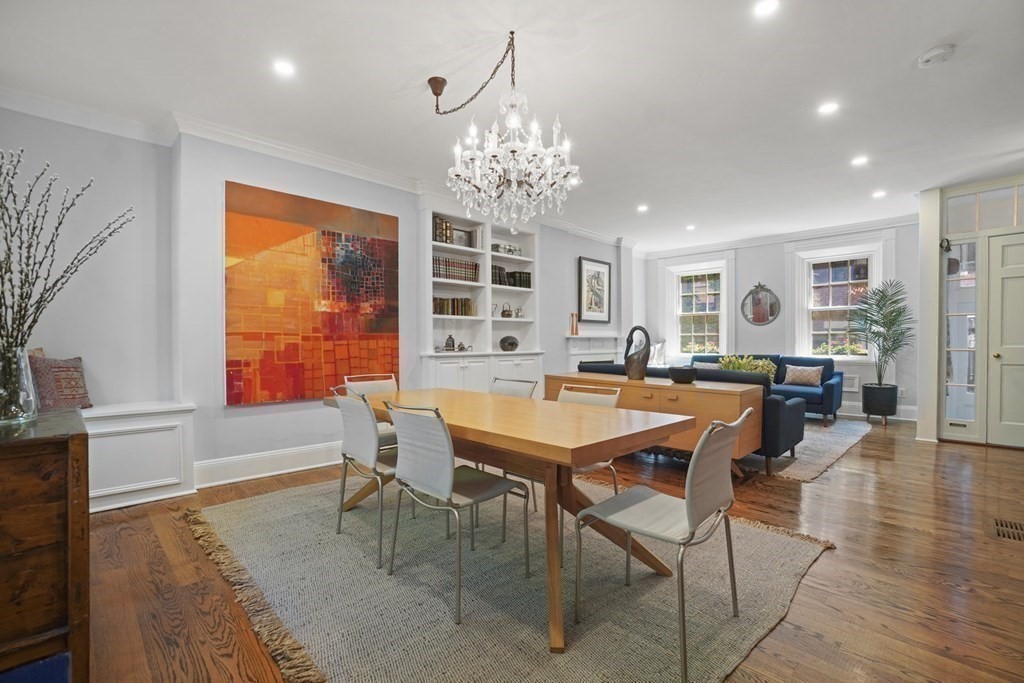 6 Strong Place Boston, MA 02114 - Photo 10 of 38 a large dining space with furniture window and wooden floor
