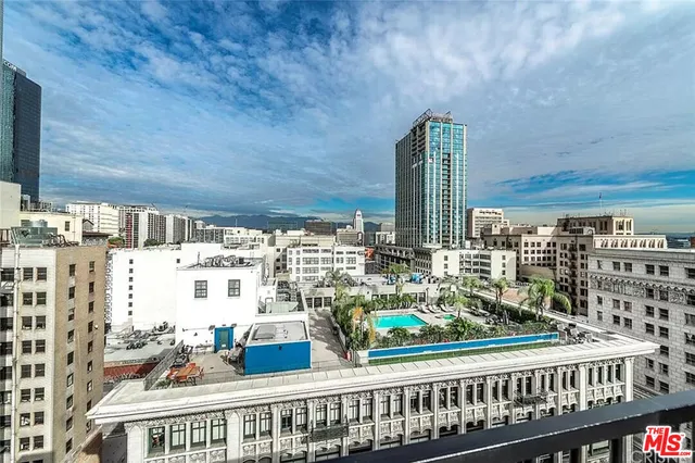 a view of a room with a table and chairs