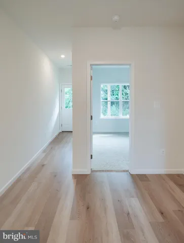 a kitchen with stainless steel appliances granite countertop a stove a sink and a wooden floors