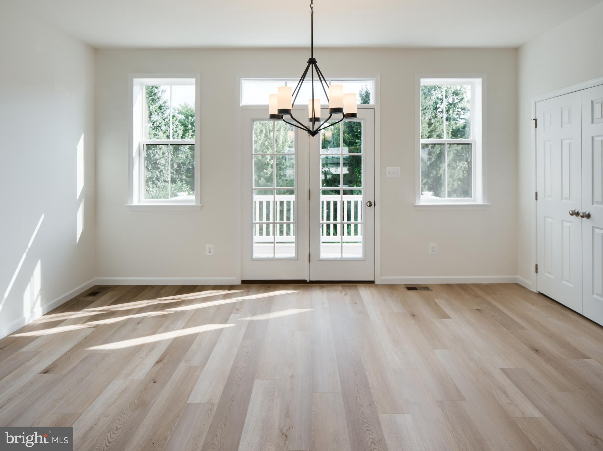 2611 Front Shed Drive Frederick, MD 21702 - Photo 21 of 78 a view of an empty room with wooden floor and a window