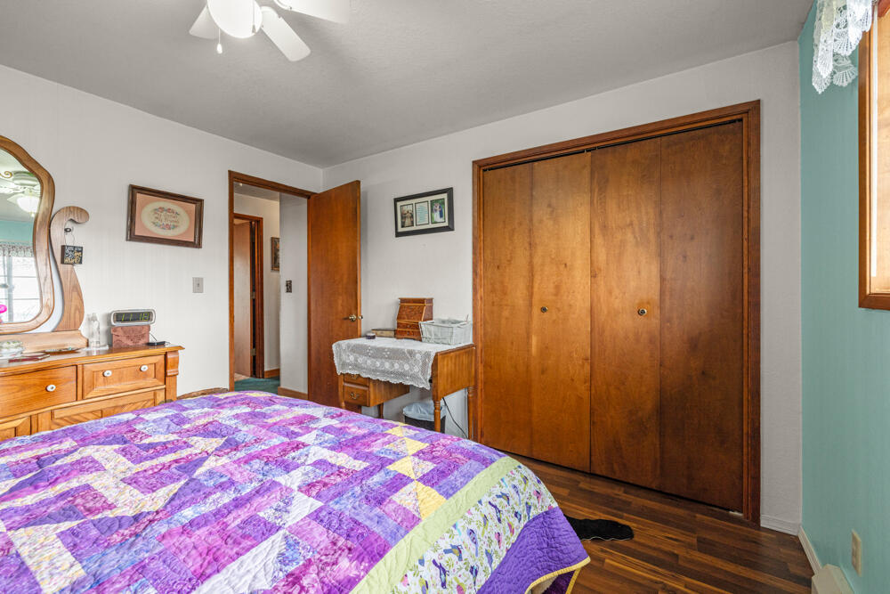 47477 Gerber Road Bonanza, OR 97623 - Photo 45 of 63 a bedroom with a bed and a chandelier